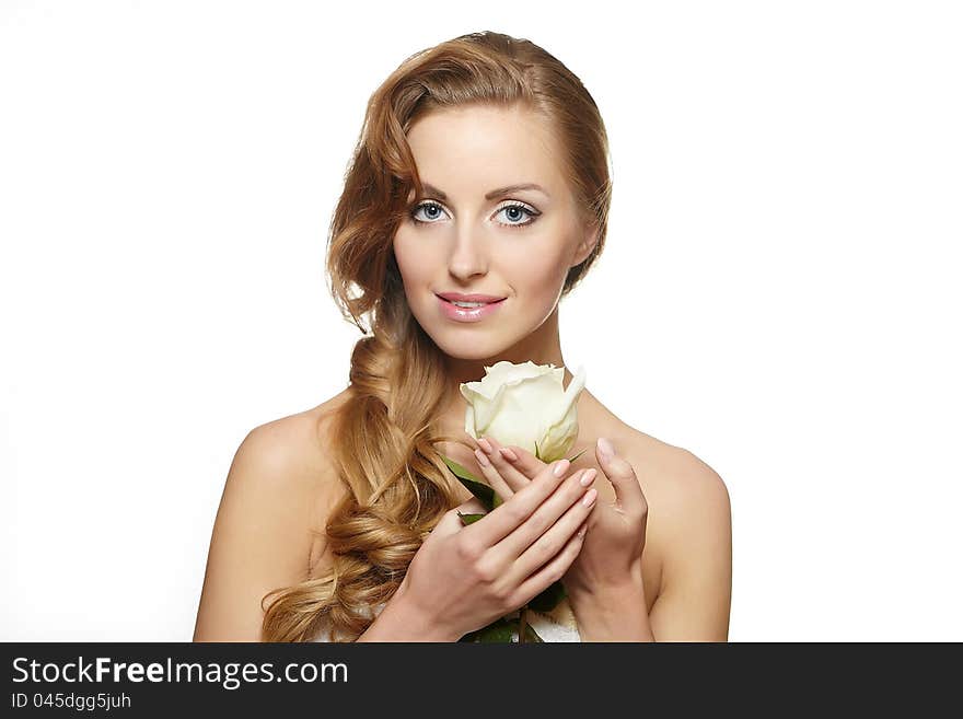 Smiling beautiful woman with white rose