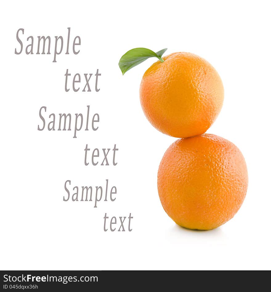 Two oranges stand on each other