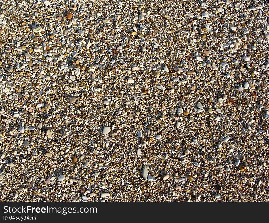 The background of black and white stones at the sea sea. The background of black and white stones at the sea sea