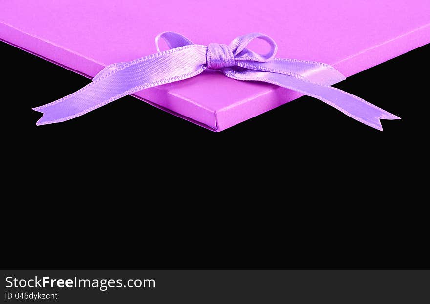 Pink compliment card on black background