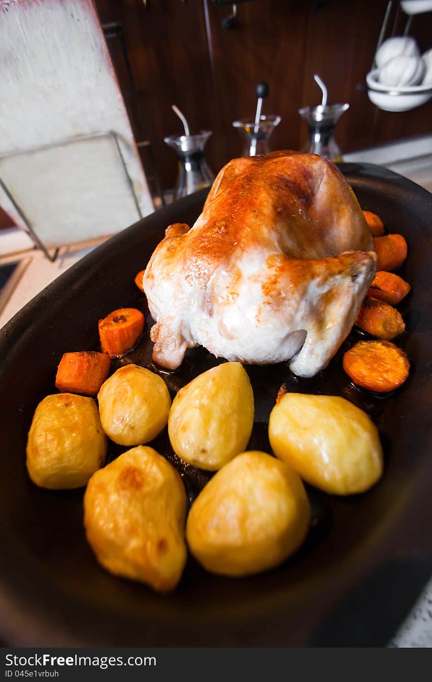 Pan fried chicken with some potatoes