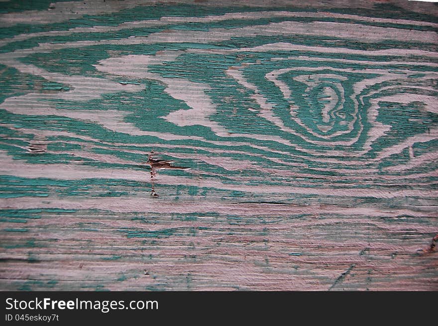 Wooden texture on the wall with traces of green paint. Wooden texture on the wall with traces of green paint