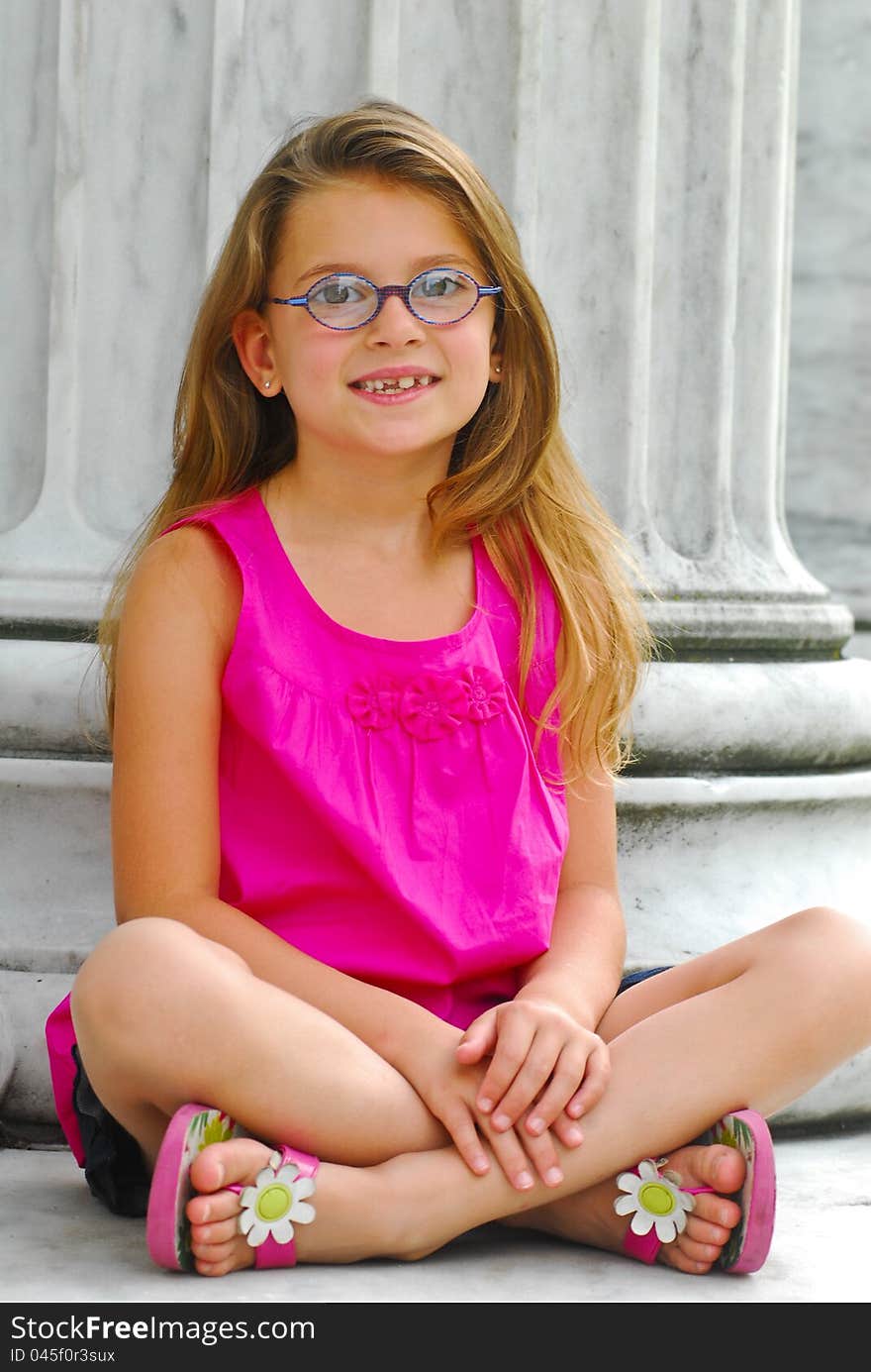 Young Girl Sitting on Marble Steps