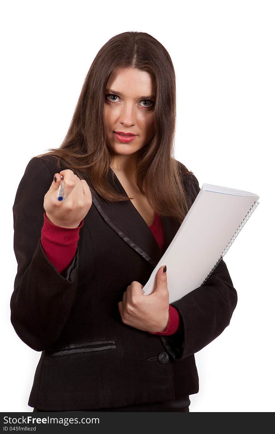 The girl with a notebook and pen on a white background. The girl with a notebook and pen on a white background