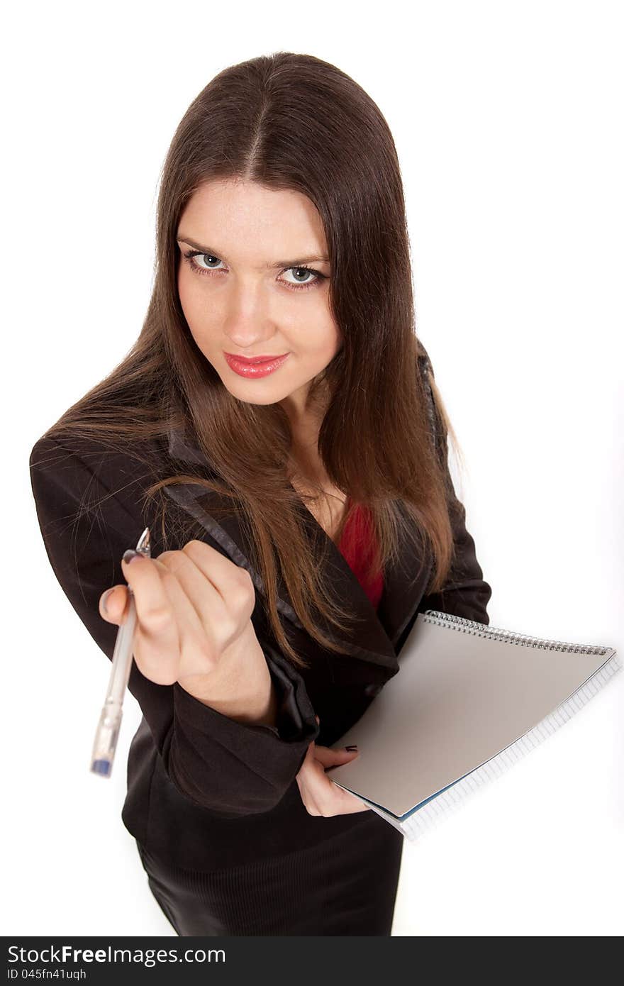 The girl with a notebook and pen on a white background. The girl with a notebook and pen on a white background