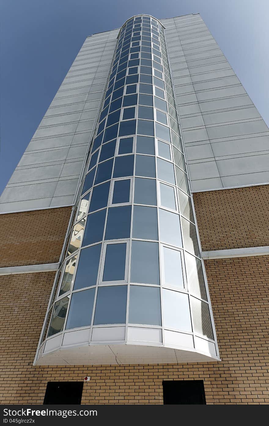 Multi-storey house with a bay window at the blue sky. Multi-storey house with a bay window at the blue sky.