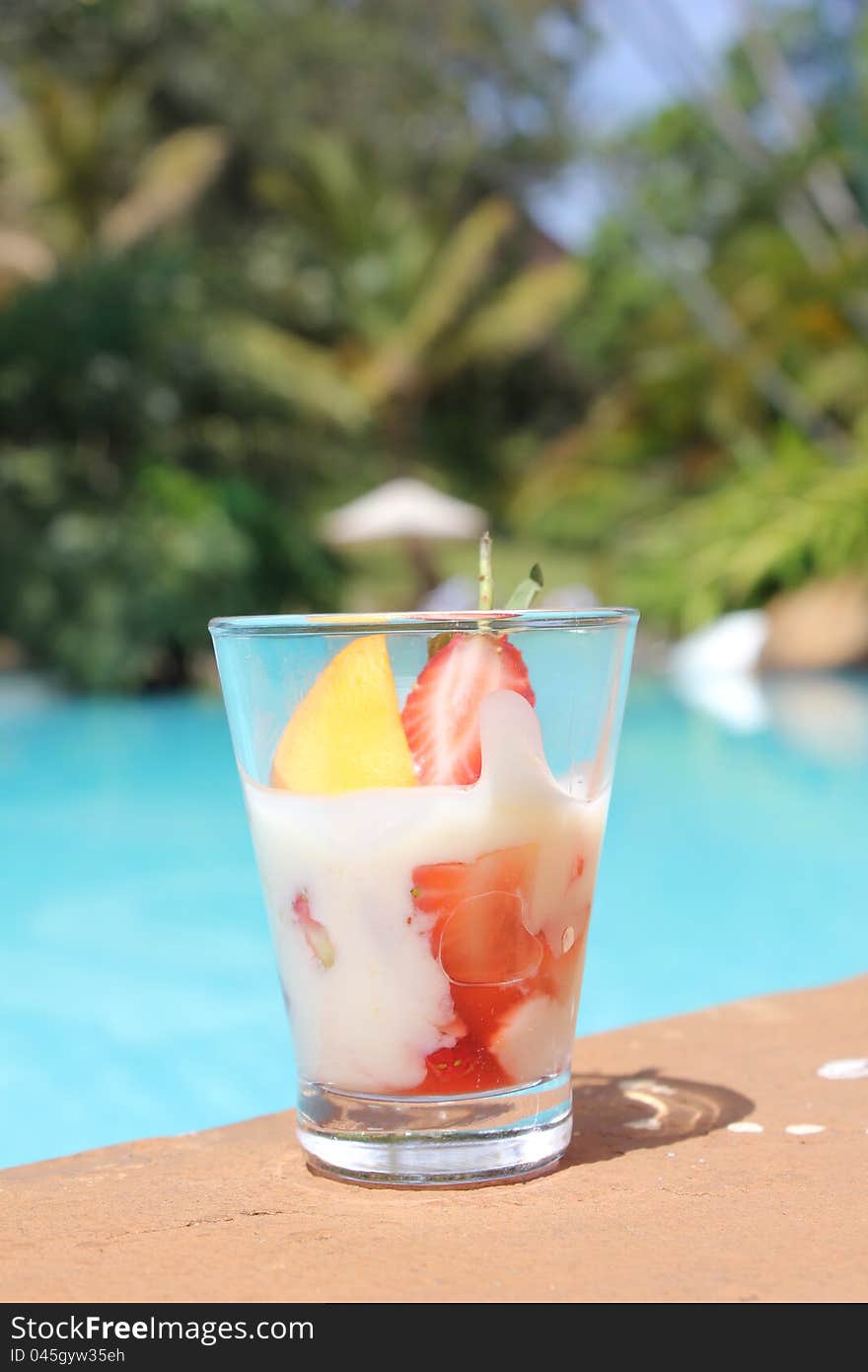 Exotic cocktail by tropical swimming pool in Nairobi, Kenya