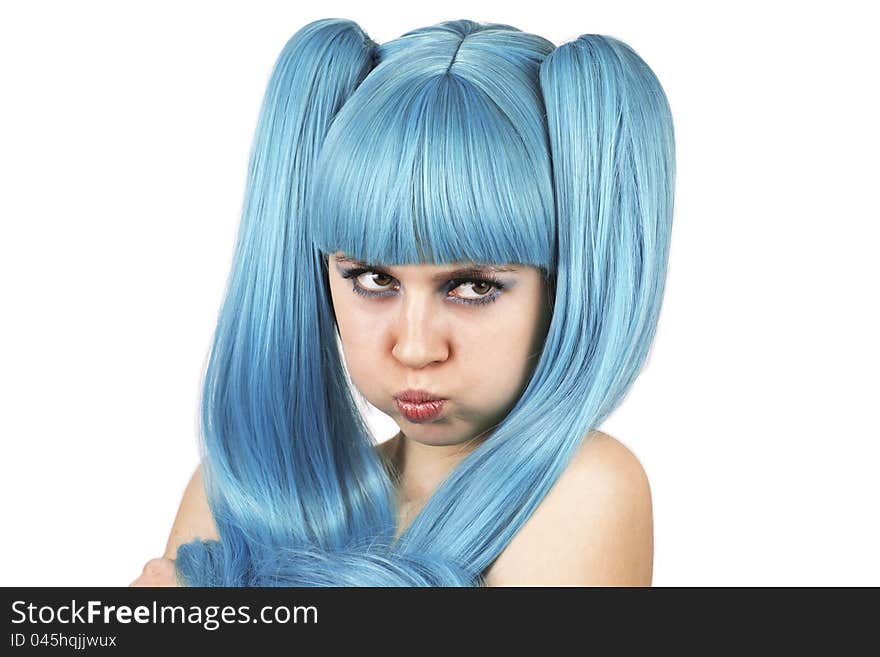 Grimacing cute woman in blue wig over white background. Grimacing cute woman in blue wig over white background