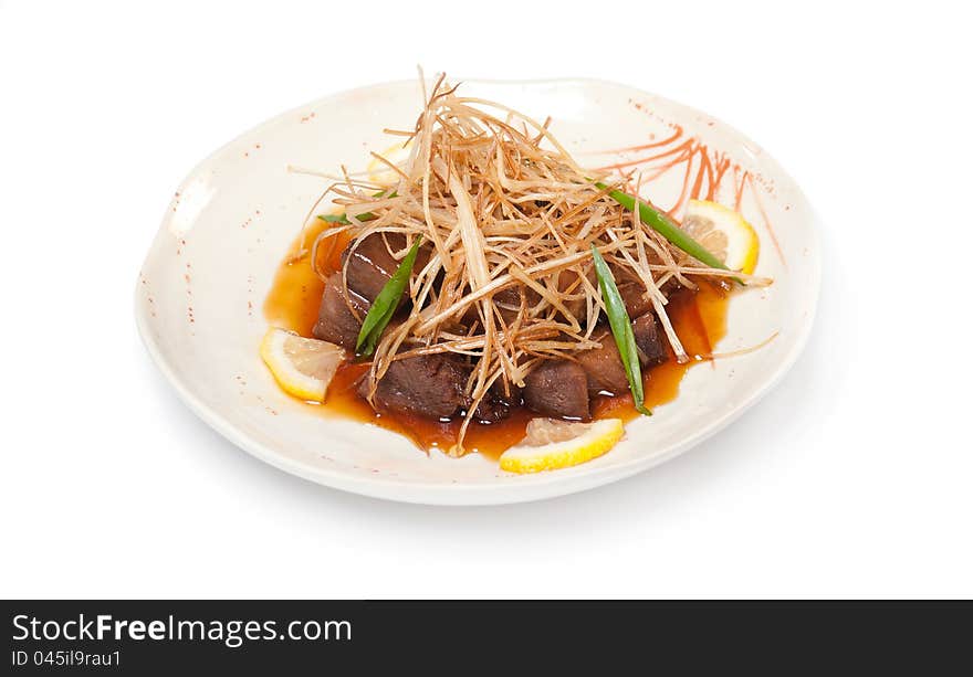 Slices of fried beef, sweet and sour sauce