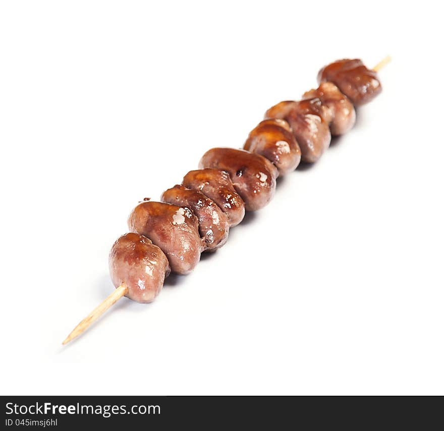 Grilled Chicken Heart on a skewer on white background