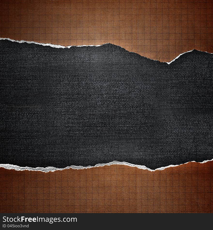 Riped cell paper on denim background. Riped cell paper on denim background