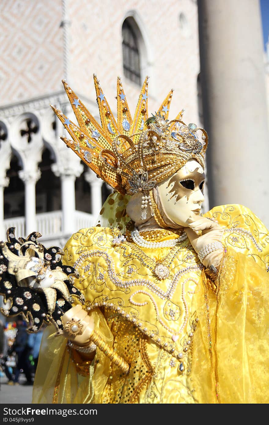 A detail of yellow venetian mask. A detail of yellow venetian mask