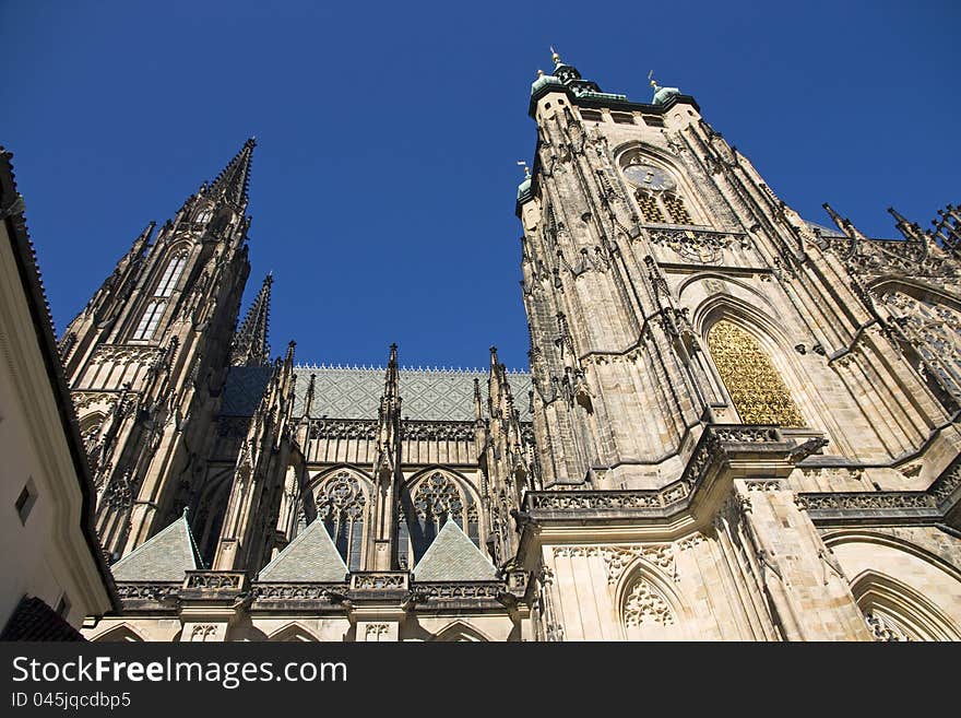 St. Vitus Cathedral at Prague Castle, St. Vitus Cathedral side, St. Vitus Cathedral on a sunny day, St. Vitus Cathedral with blue sky, tourist place in Prague