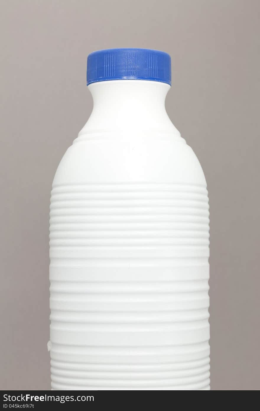 Bottle of milk in a plastic container