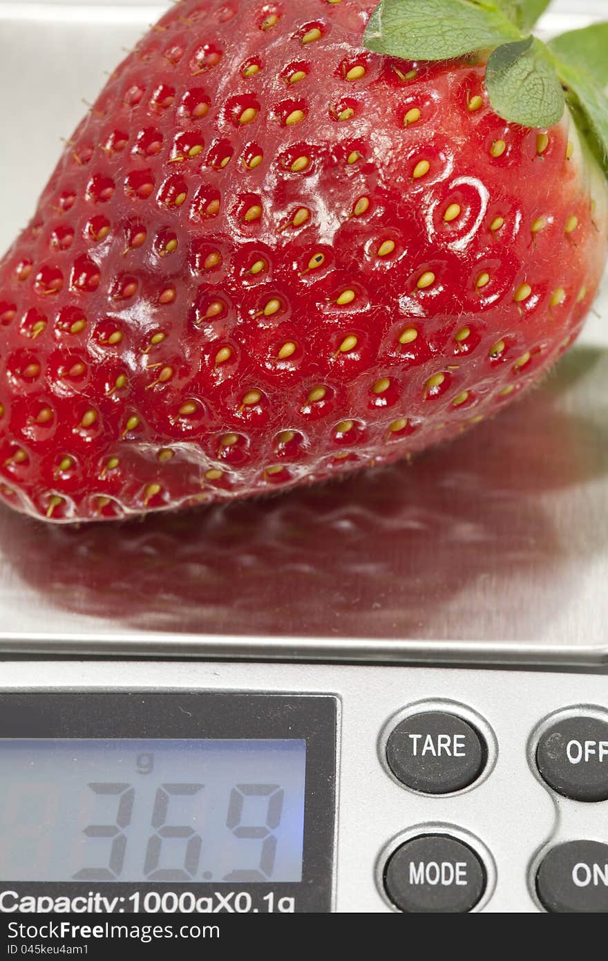 Scales with a strawberry to see your weight. Scales with a strawberry to see your weight