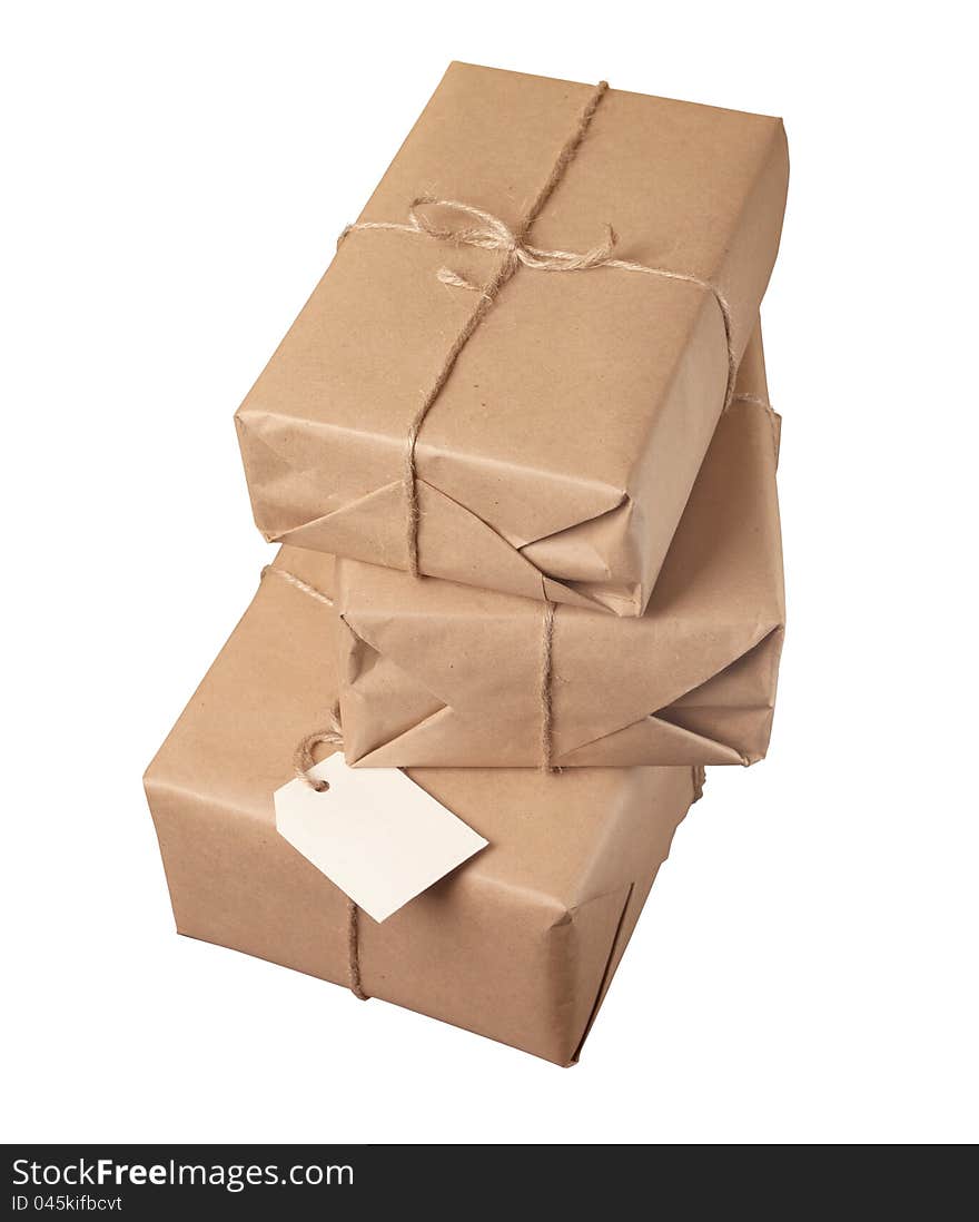 Parcel wrapped with brown paper tied with rope isolated on white background. Parcel wrapped with brown paper tied with rope isolated on white background