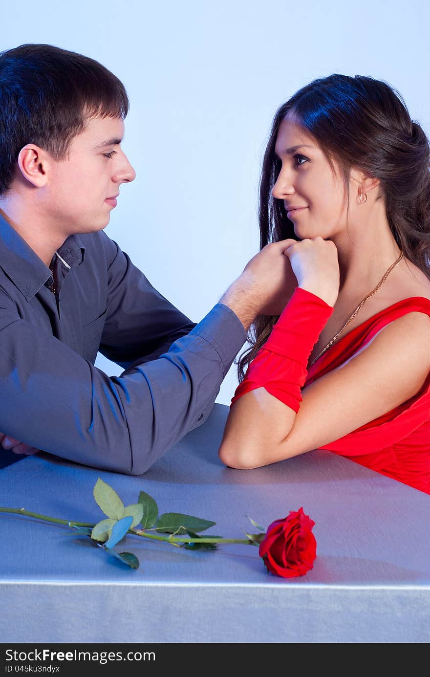 Couple in love, the rose is on the table