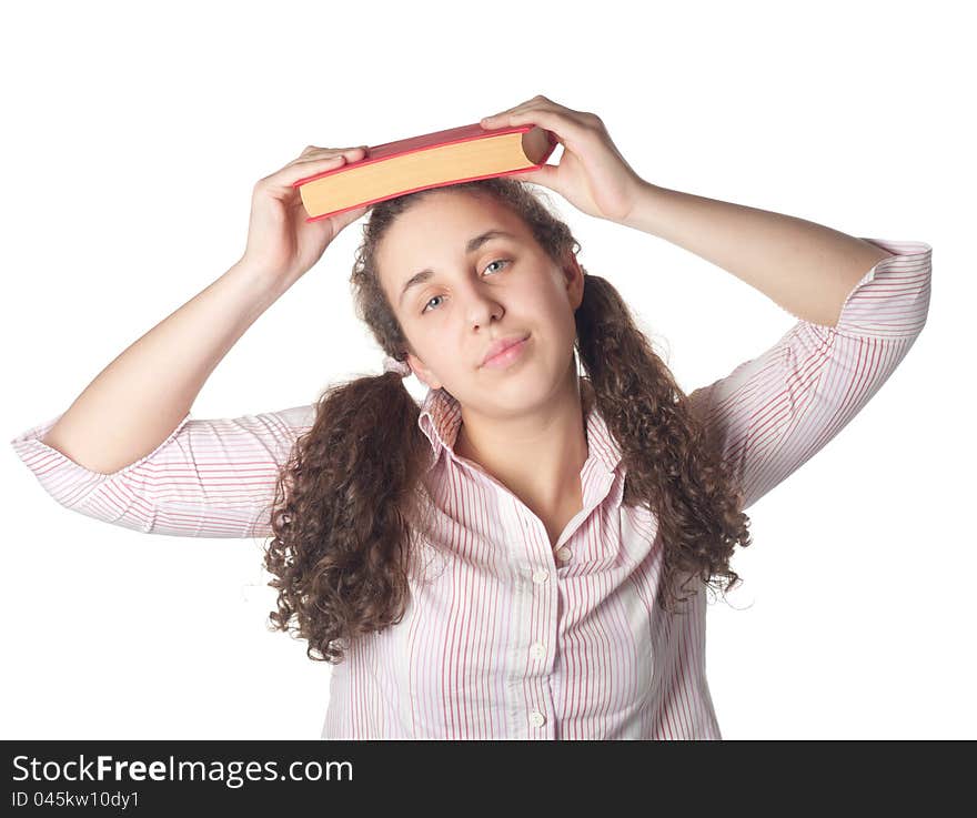 Young student girl with her books in hand at head, smiling and looking at the camera