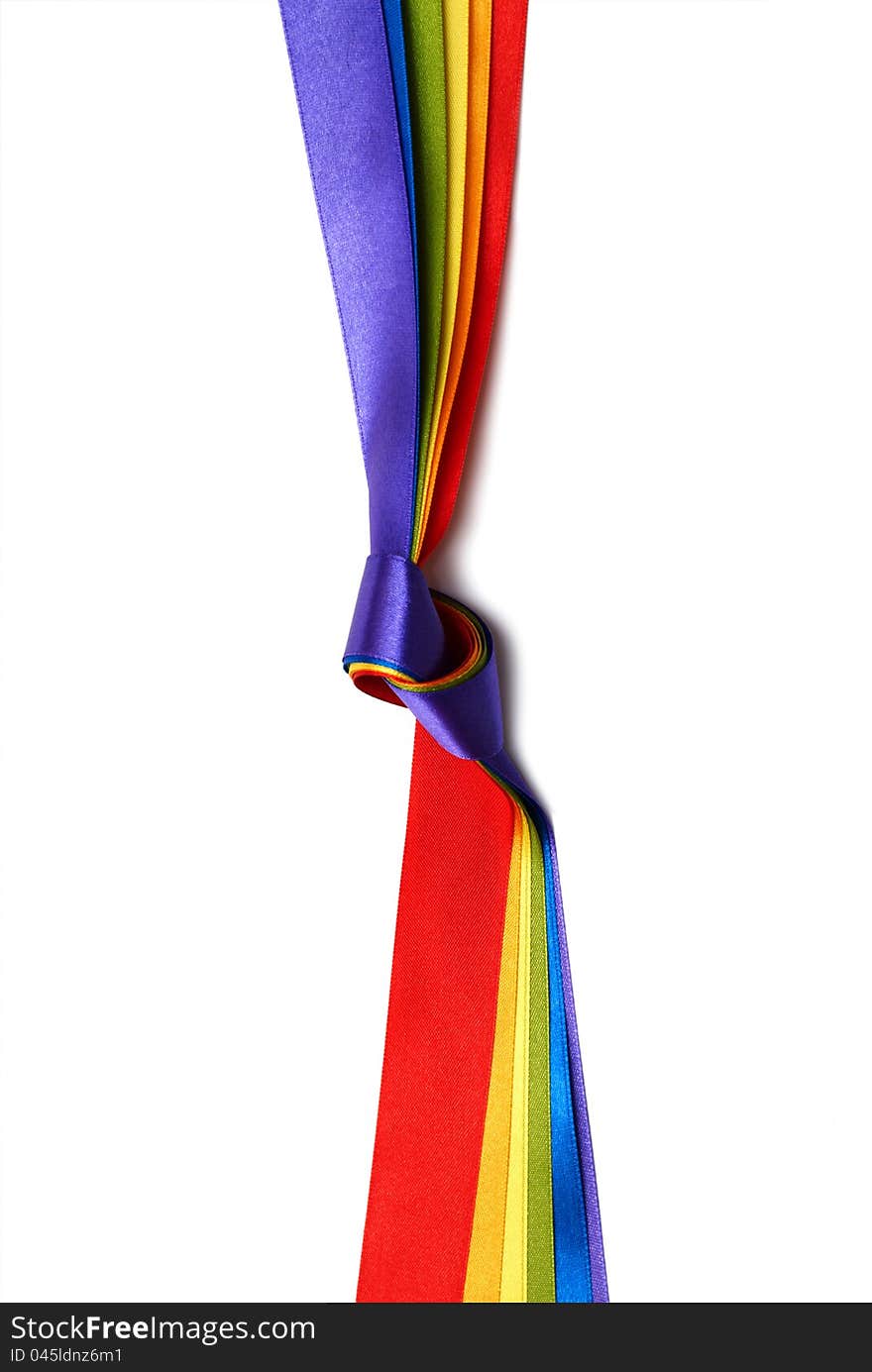 Rainbow flag background made of slim stripes in knot