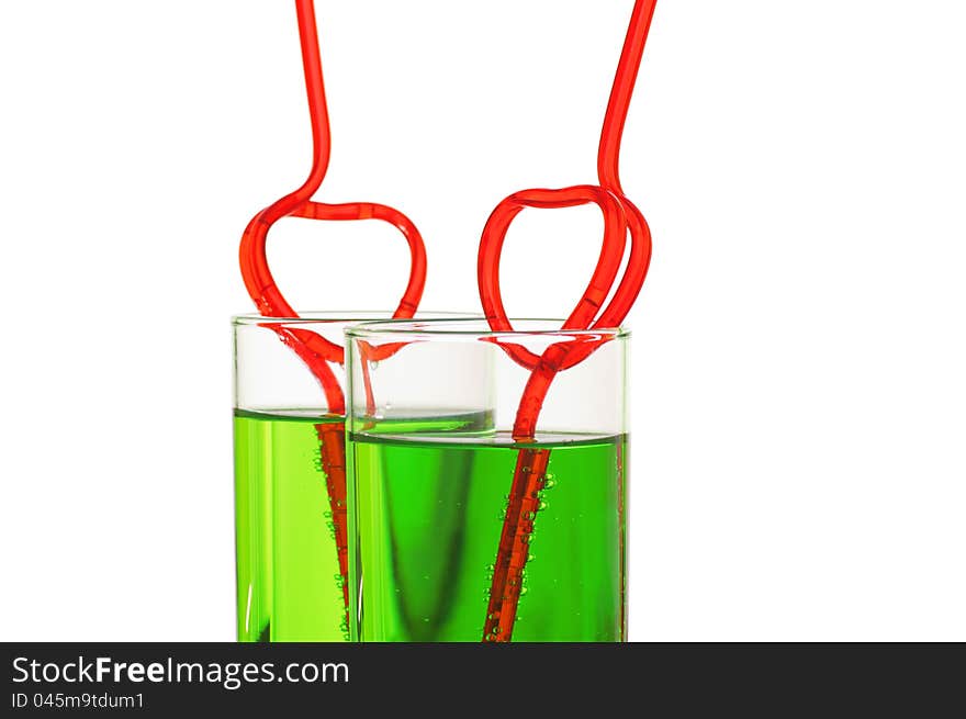 Two glasses with heart straws