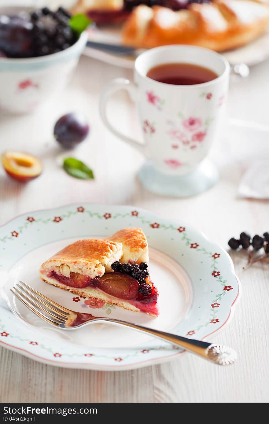 Piece of plum and aronia galette, selective focus. Piece of plum and aronia galette, selective focus