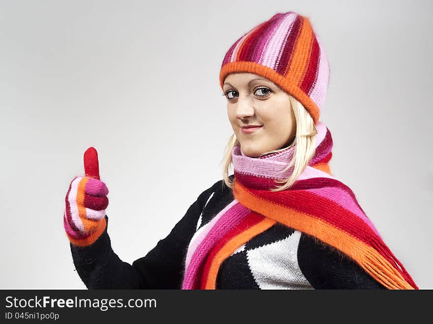 Girl in a hat and gloves, shows approximately. Girl in a hat and gloves, shows approximately