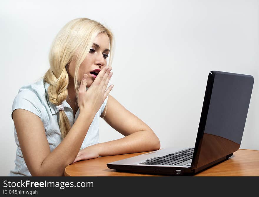 Beautiful girl falls asleep at the computer