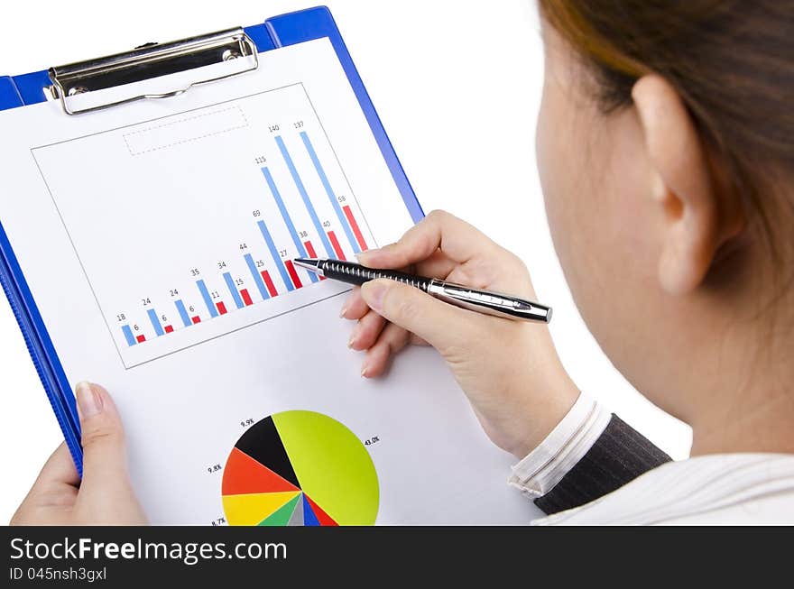 A businesswoman look at a business chart. A businesswoman look at a business chart