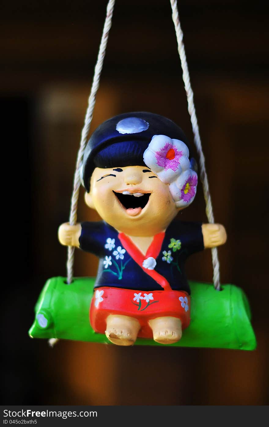 Smile doll in a garden