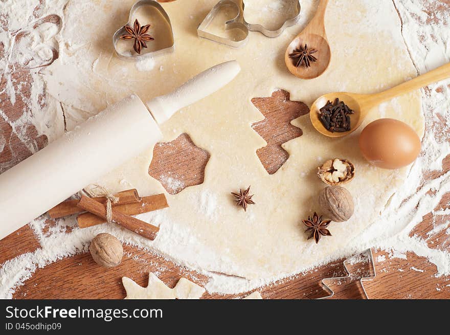 Baking background with dough, spices and cookie cutters