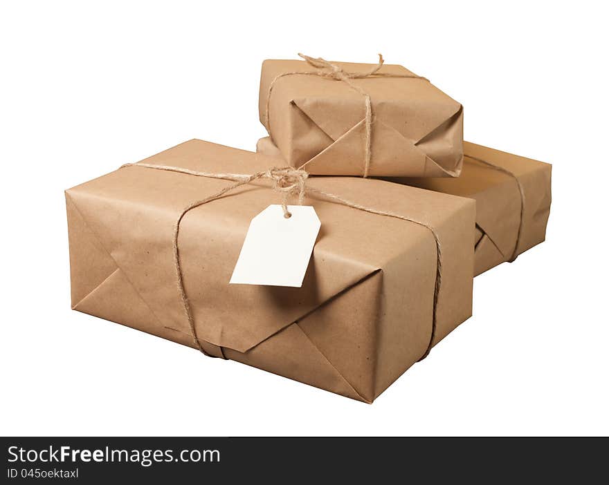 Parcel wrapped with brown paper tied with rope isolated on white background. Parcel wrapped with brown paper tied with rope isolated on white background