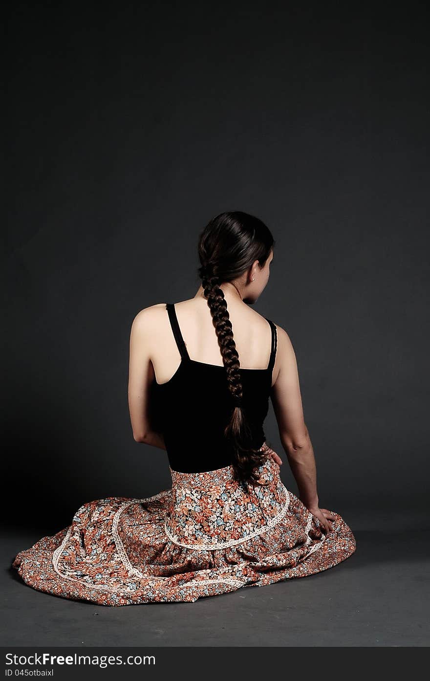 Girl with skirt posing in a studio