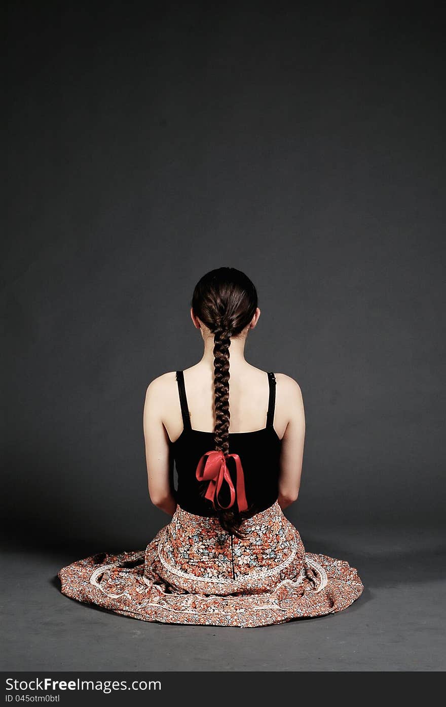 Girl with skirt posing in a studio