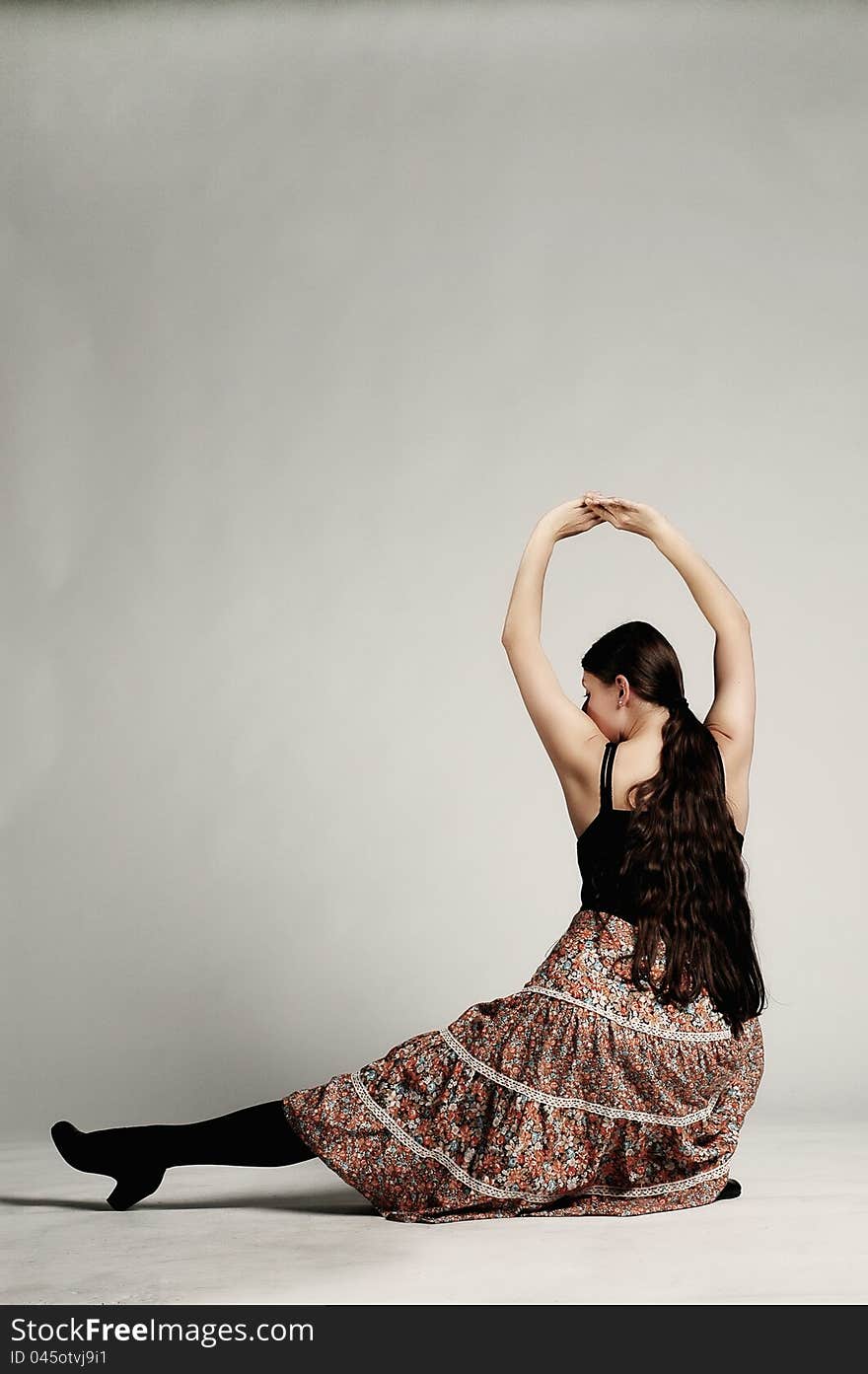 Girl with skirt posing in a studio