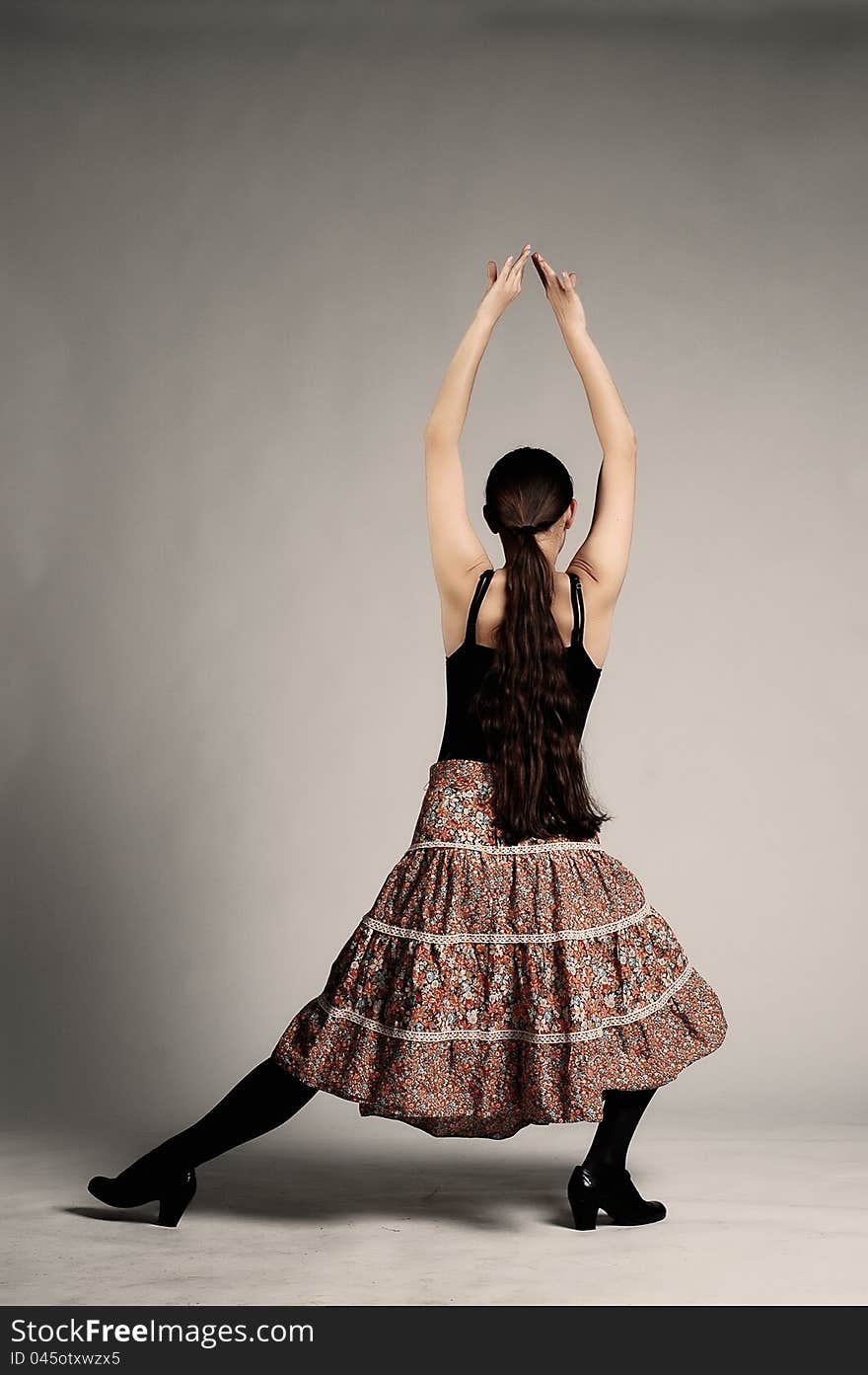 Girl with skirt posing in a studio