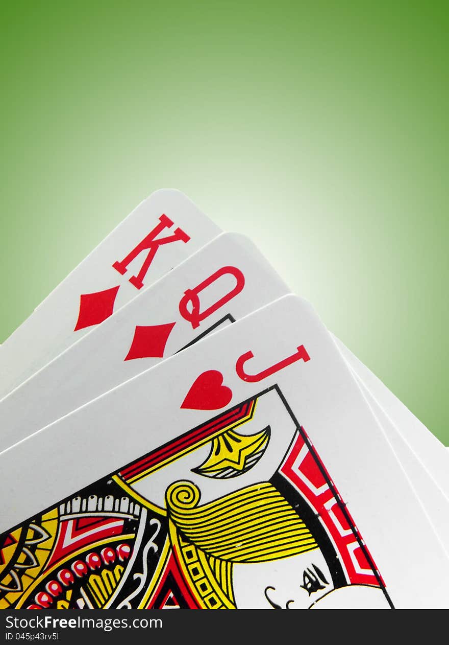 Playing cards on green background