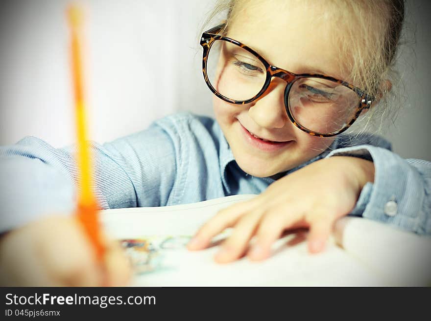 Student in big glasses smiling