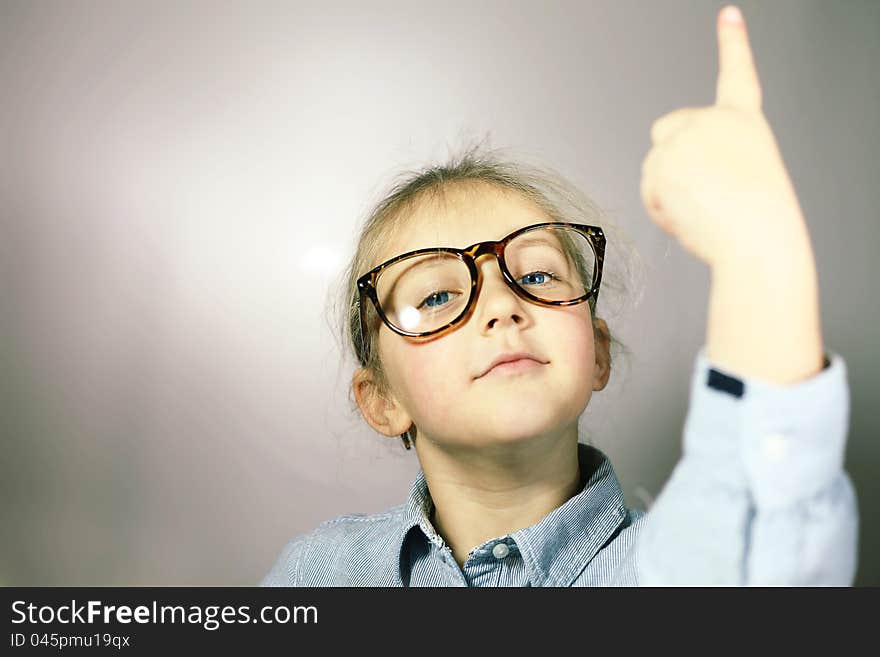 Schoolgirl with big glasses blonde with blue eyes. Schoolgirl with big glasses blonde with blue eyes