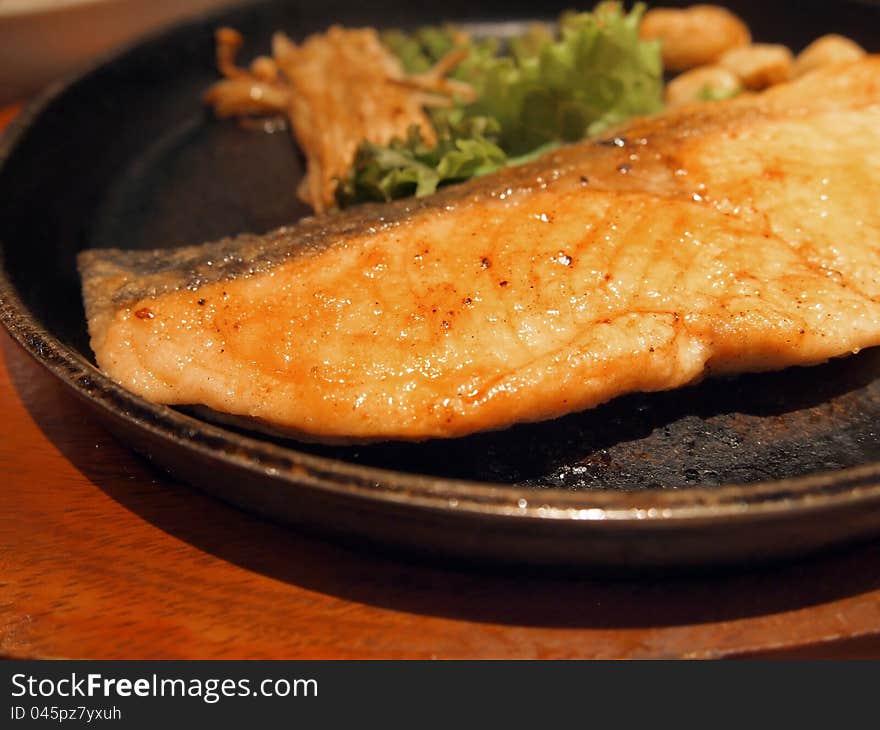 Hot pan with salmon steak