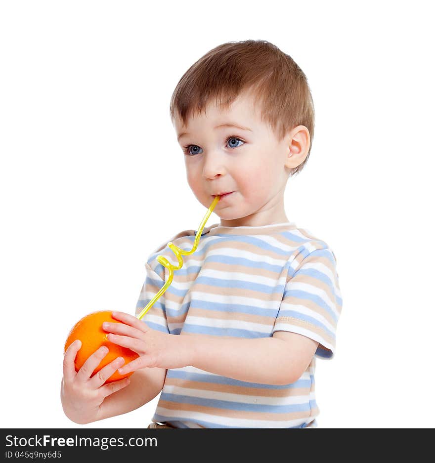 Funny child drinking orange through straw isolated over white background. Funny child drinking orange through straw isolated over white background