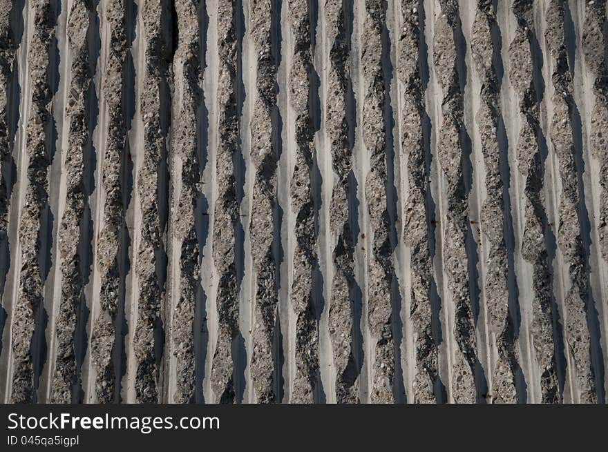 Concrete wall texture, with vertical, wavy pattern. Concrete wall texture, with vertical, wavy pattern