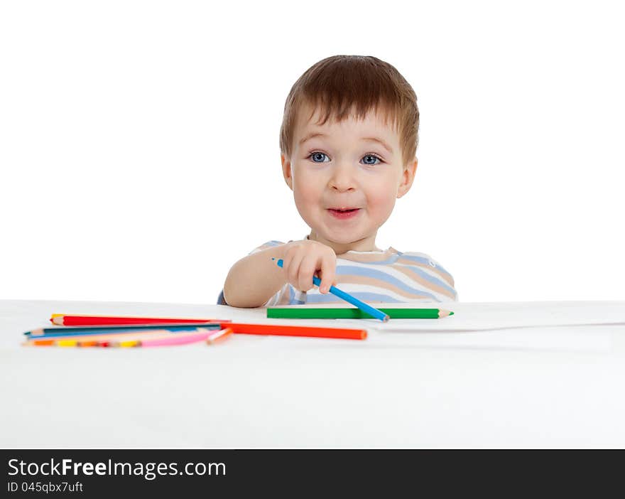 Funny baby boy drawing with color pencils