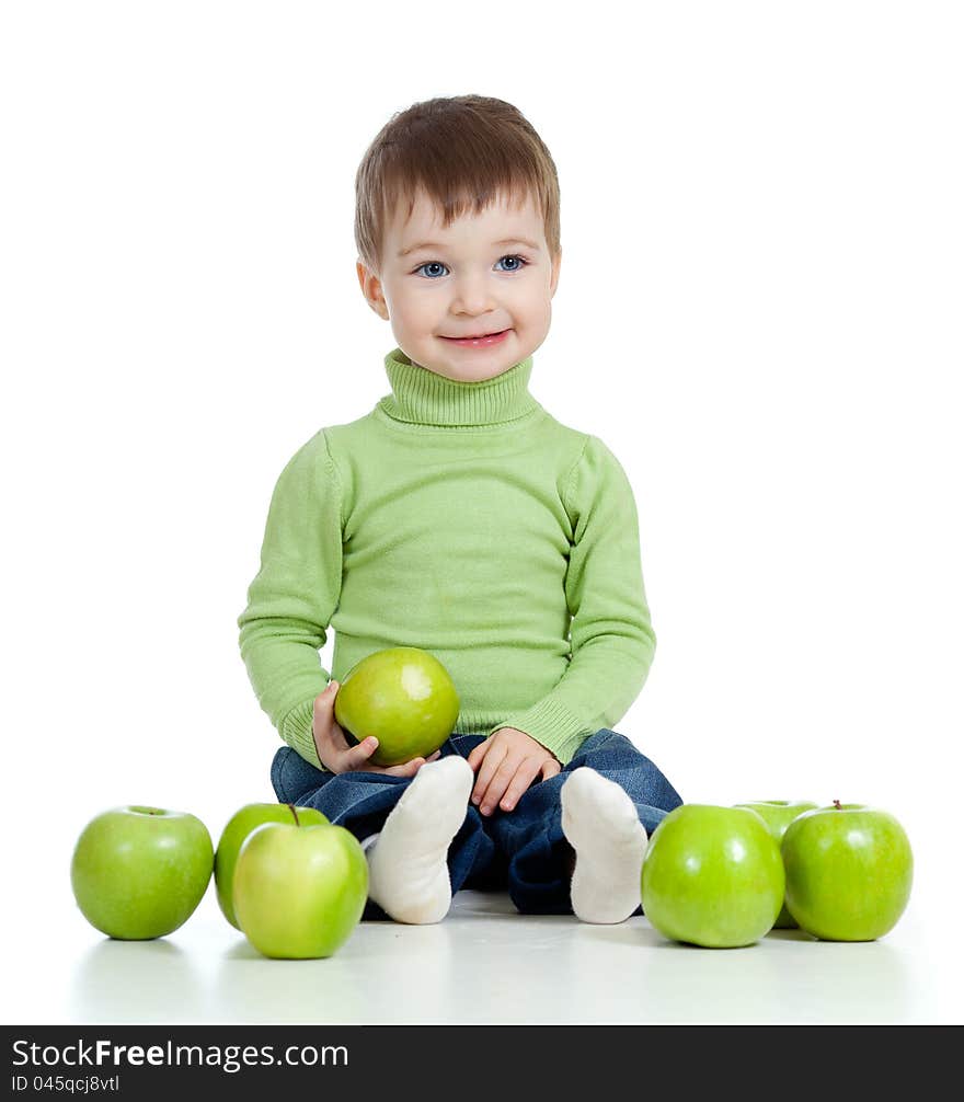 Adorable child with green apples over white background