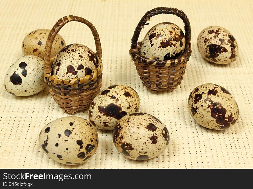 Quail eggs in the baskets. Quail eggs in the baskets