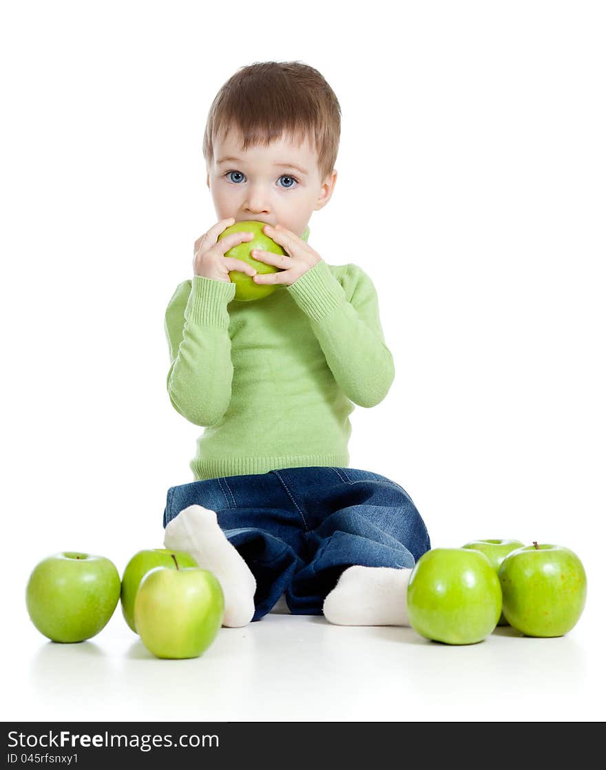 Adorable child with green apples over white background