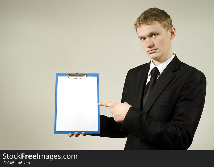 A young man shows on the plan in the studio