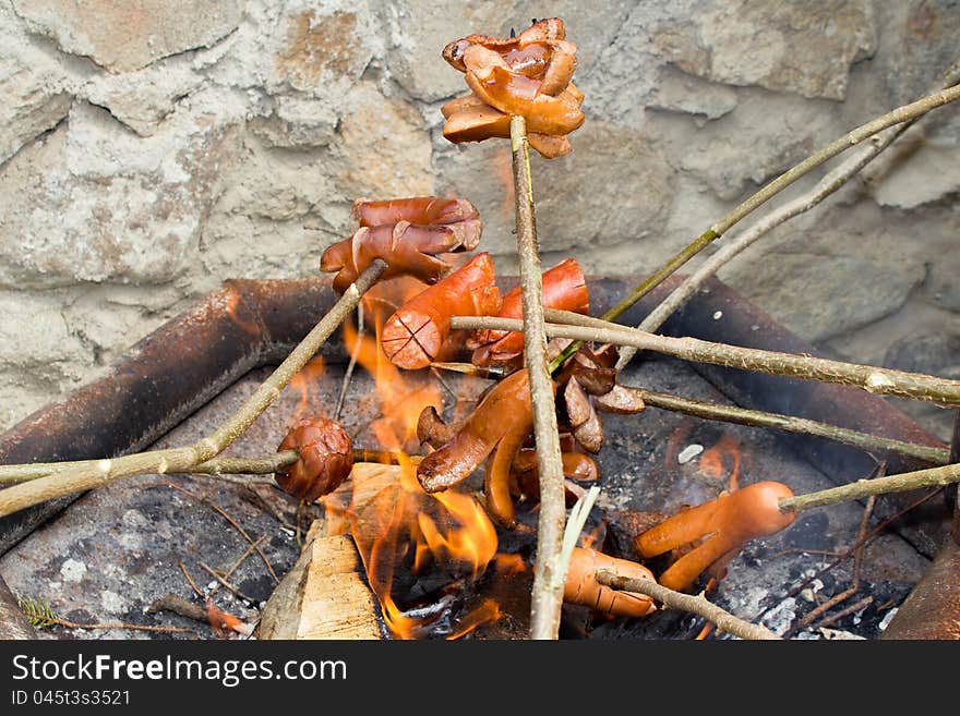 Outdoor grilling sausages