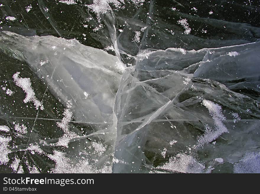 Ice on a frozen lake with dangerous cracks. Ice on a frozen lake with dangerous cracks