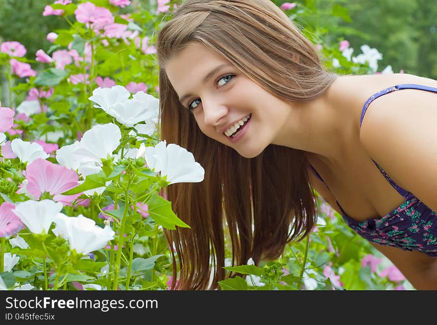 Girl with flowers in the garden