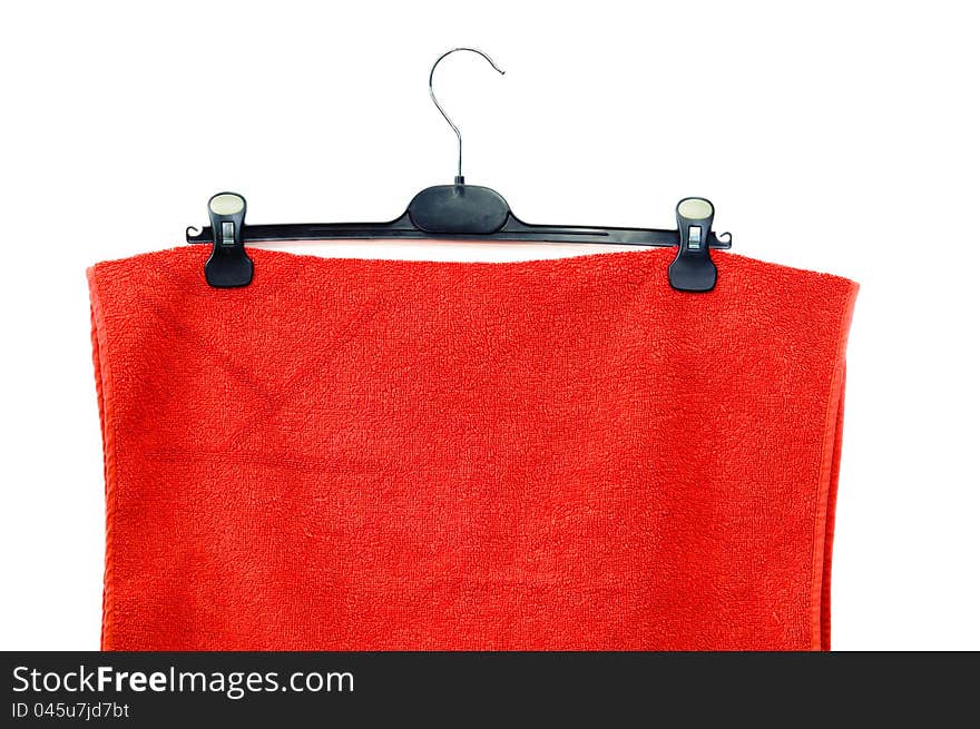 Red towel for a shower on a hanger